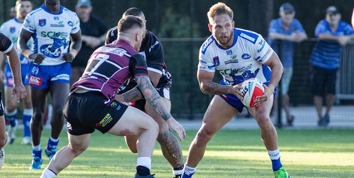 Above: Newtown Jets five-eighth Lachlan Peachey (in possession) schemes to prise open the Blacktown Workers defence last Saturday.
Photo: Mario Facchini, mafphotography