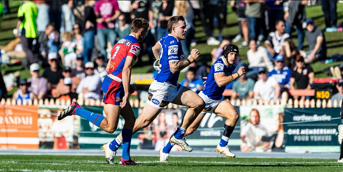 Newtown second-rower and team captain Billy Burns (in possession) was in top form as the Jets ran up a big win over the Newcastle Knights. Tom Rodwell (in the headgear) is in the background.
Photo: Mario Facchini, mafphotography
