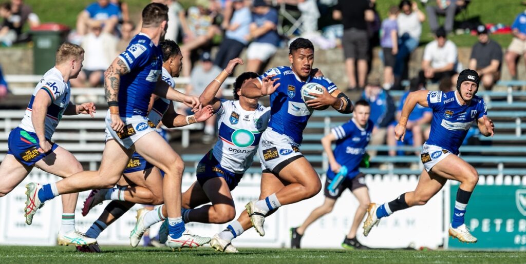 Jets centre Jordan Swann (in possession) was in impressive form on Saturday and scored a vital try in the second half. Photo: Maruio Facchini/MAF Photography